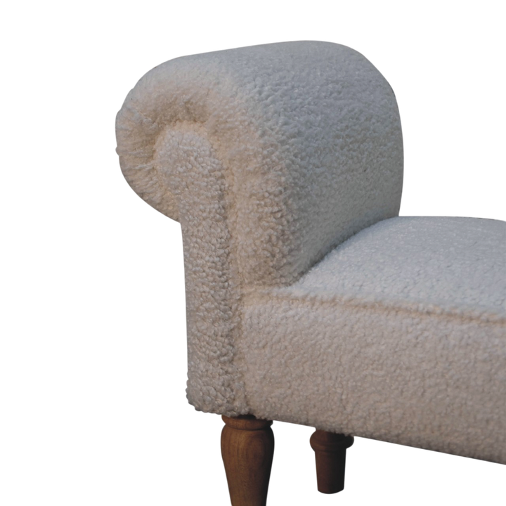 Close view of the arm on the Oakhurst Bedroom Bench in Alabaster Bouclé.