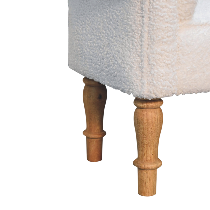 Close view of the legs on the Oakhurst Bedroom Bench in Alabaster Bouclé.