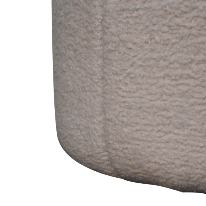 Close view of the seat on the Oakhurst Drum Footstool in Alabaster Bouclé.