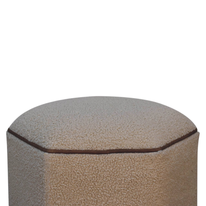 Close view of the seat on the Oakhurst Hexagonal Footstool in Cream Bouclé with Tobacco Piping.