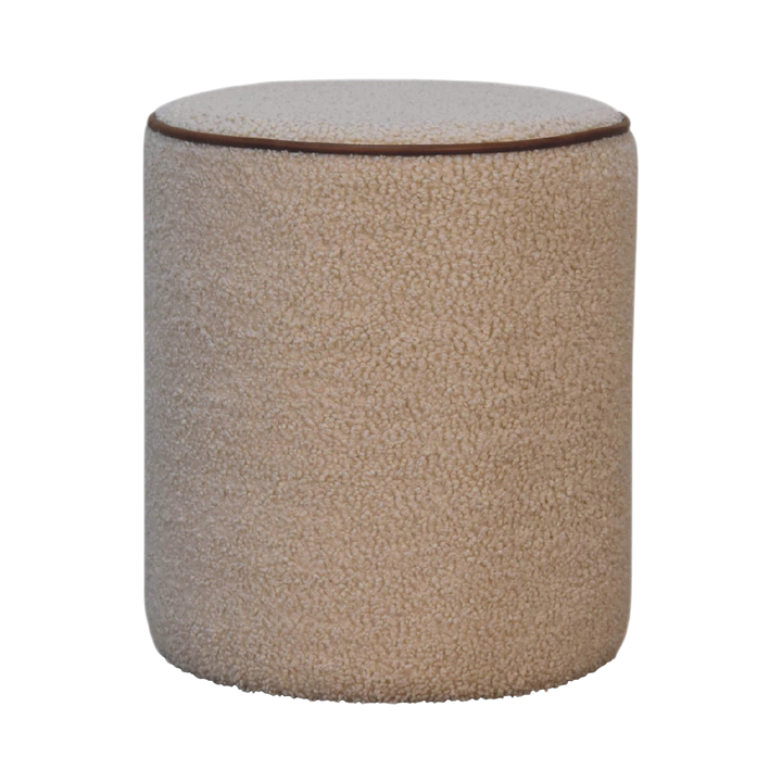 Oakhurst Round Footstool in Cream Bouclé with Tobacco Piping, front view. Cream bouclé in cotton and natural yarn over a solid hardwood frame, tobacco leather piping to the rim.