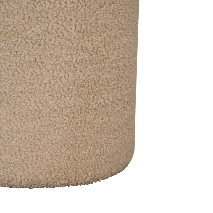 Close view of the bouclé on the Oakhurst Round Footstool in Cream Bouclé with Tobacco Piping.