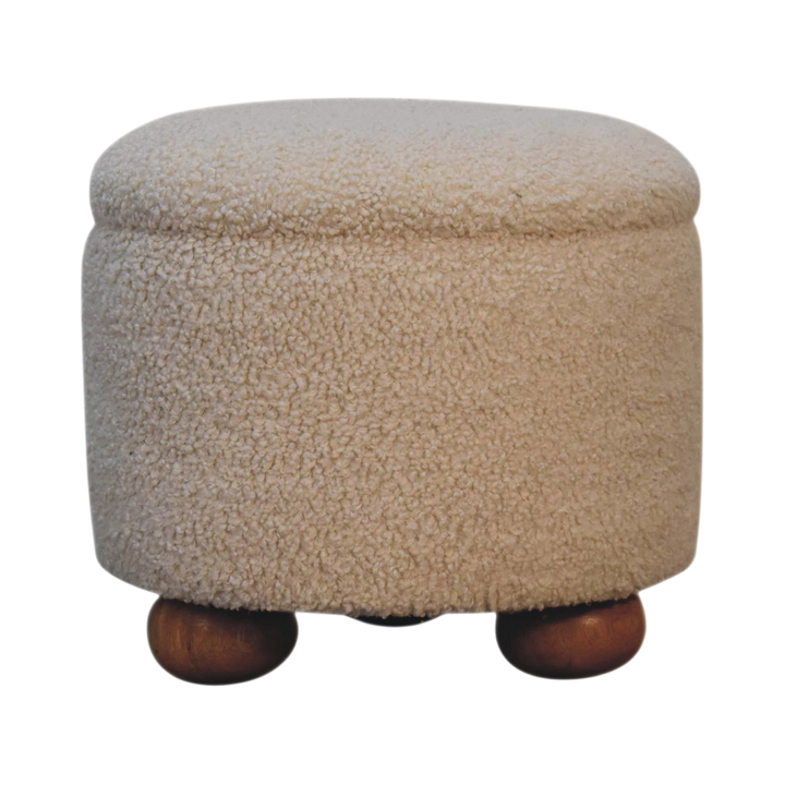 Oakhurst Storage Footstool in Cream Bouclé, front view. Cream bouclé in cotton and natural yarn over a solid hardwood frame, lift-up lid, hollow storage interior.