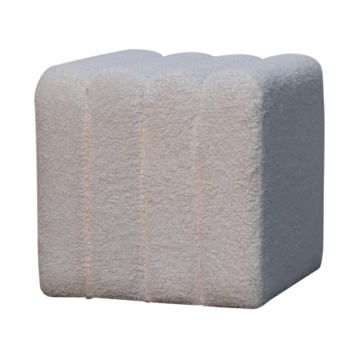 Oakhurst Wave Footstool in Alabaster Bouclé, three-quarter view showing the full profile.