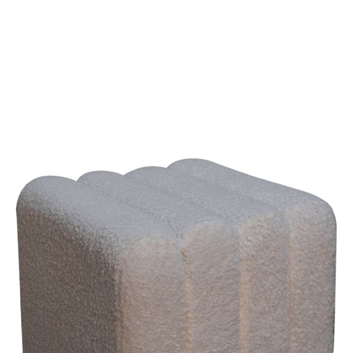 Close view of the edge on the Oakhurst Wave Footstool in Alabaster Bouclé.