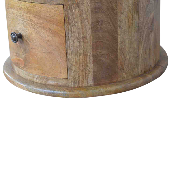 Close view of the base on the Odense 3-Drawer Drum Chest in Amber.