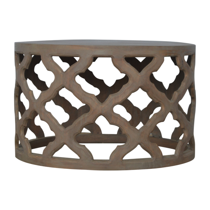 Palladio Carved Stool in Stone, front view. 100% solid hardwood in a pale stone finish, hand-carved cut-through floral base, round top.