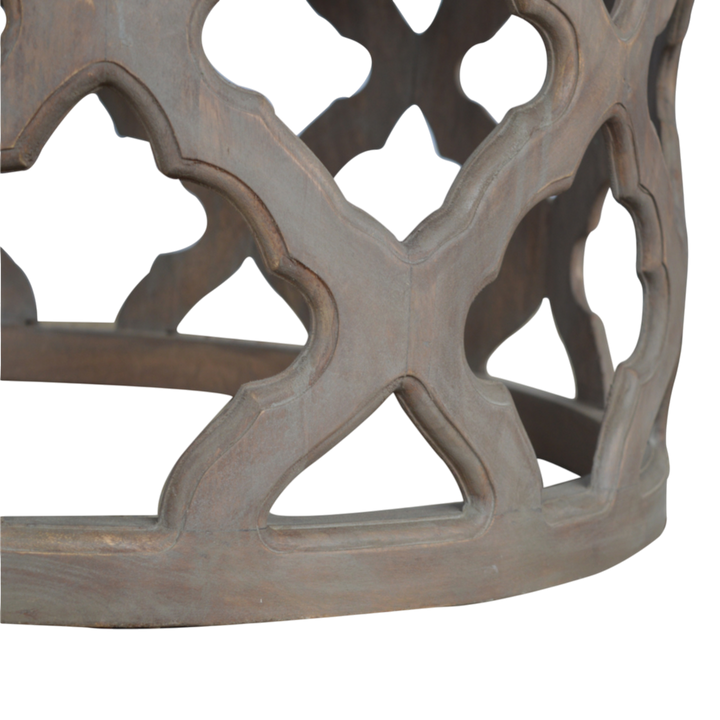 Close view of the carved detailing on the Palladio Carved Stool in Stone.