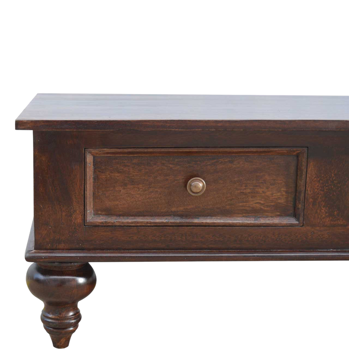Close view of the drawer front and knob on the Radcliffe Library Table in Espresso.