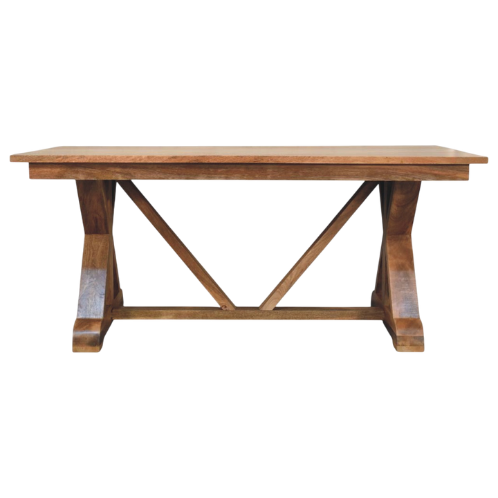 Refectory Trestle Table in Amber, front view. A broad solid wood top on a trestle base.