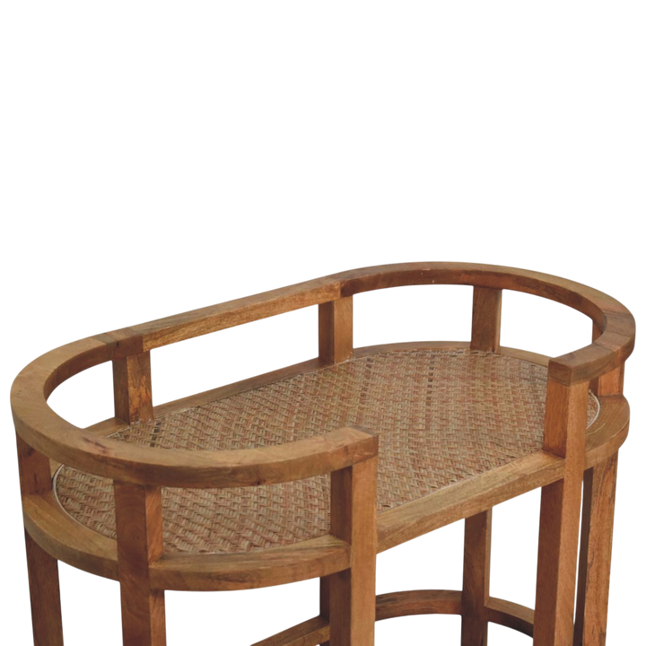 Close view of the rattan wrap on the base on the Savoy Bar Cart in Amber.