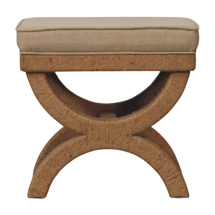 Serafina Curule Stool in Clay Linen, front view. Rattan-wrapped curved legs with a clay linen seat.