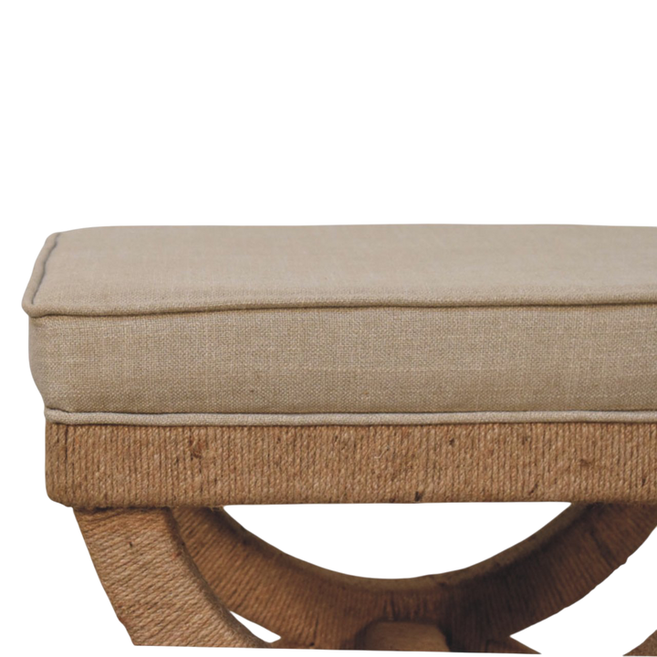 Close view of the upholstered seat on the Serafina Curule Stool in Clay Linen.