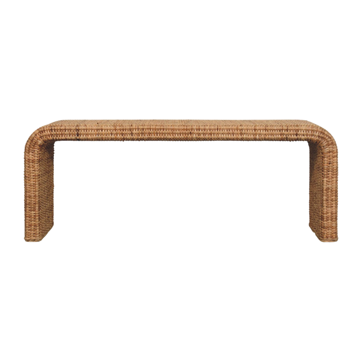 Serafina Waterfall Bench, front view. A continuous curve of woven rattan over a warm oak frame.