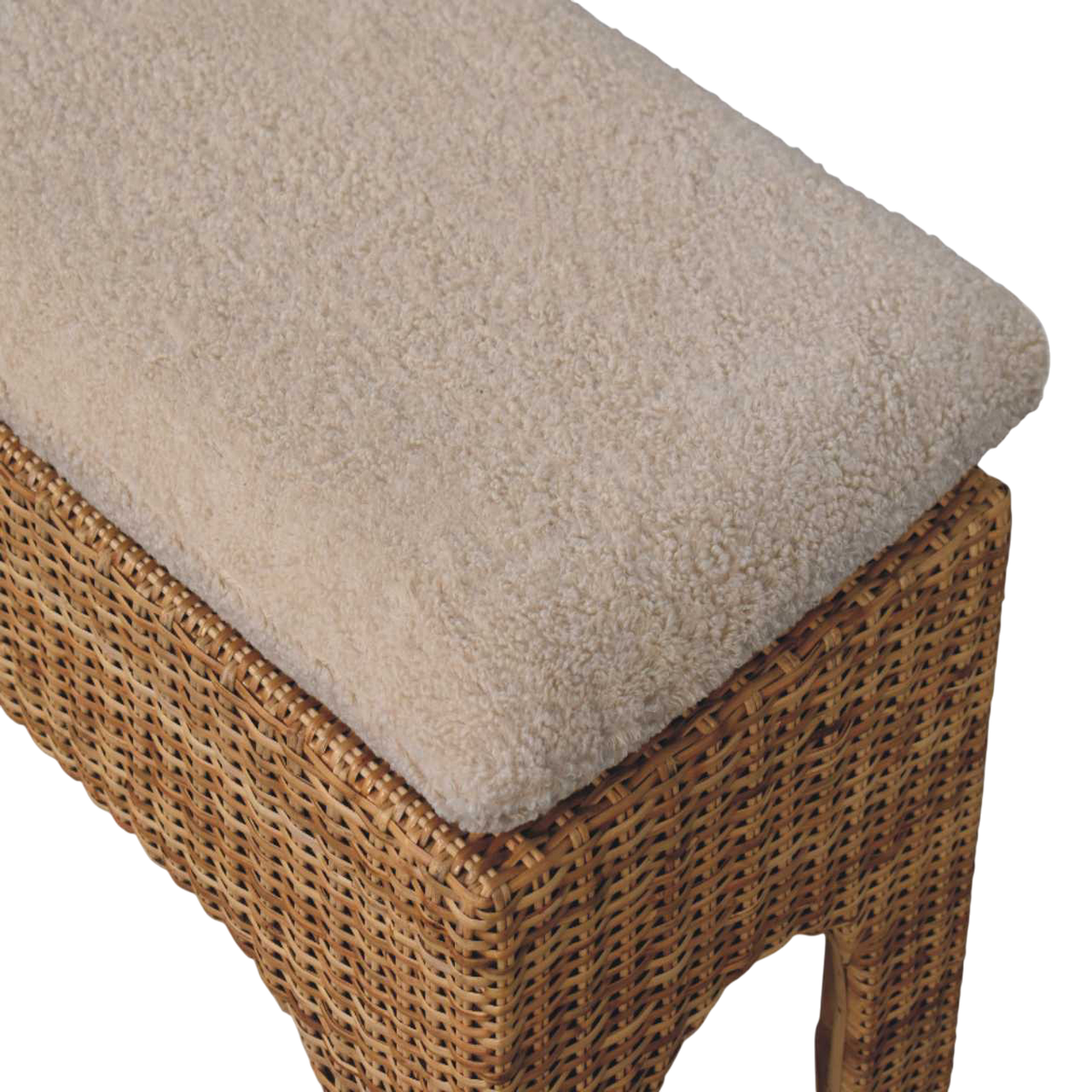 Close view of the upholstered seat on the Serafina Woven Bench in Natural Rattan and Cream Bouclé.
