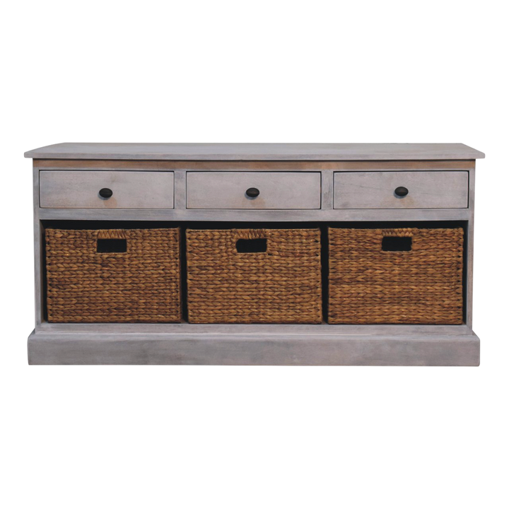 Sigtuna Basket Media Unit in Stone, front view. Solid hardwood in a weathered stone finish, three drawers over three handwoven wicker baskets.