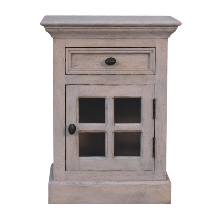Sigtuna Glazed Bedside Table in Stone, front view. Stone-finished hardwood with a glazed door and brass knob.