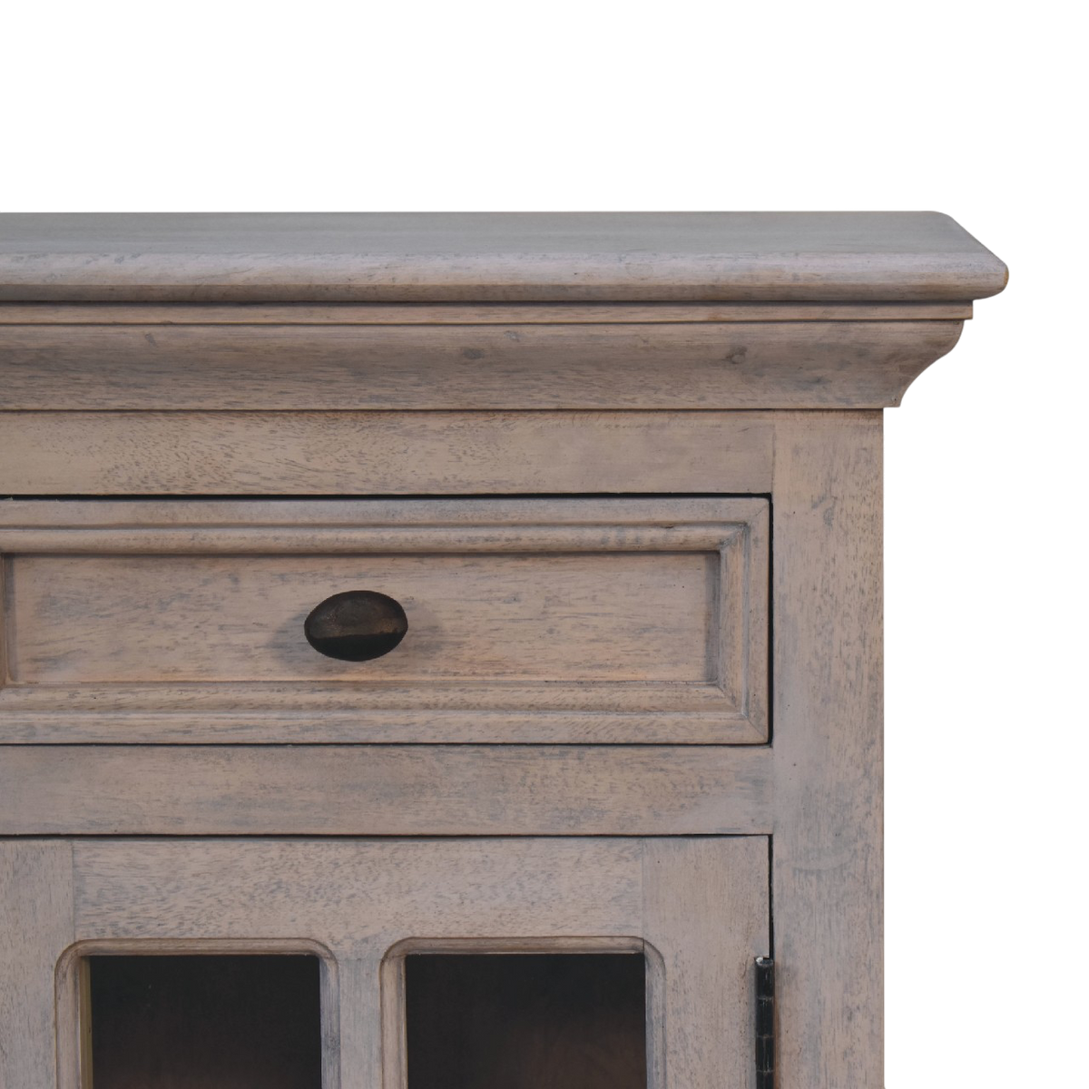 Close view of the glazed door and brass knob on the Sigtuna Glazed Bedside Table in Stone.