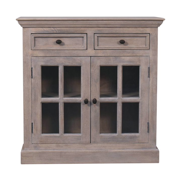 Sigtuna Glazed Cabinet in Stone, front view. Stone-finished hardwood with glazed doors and brass knobs.