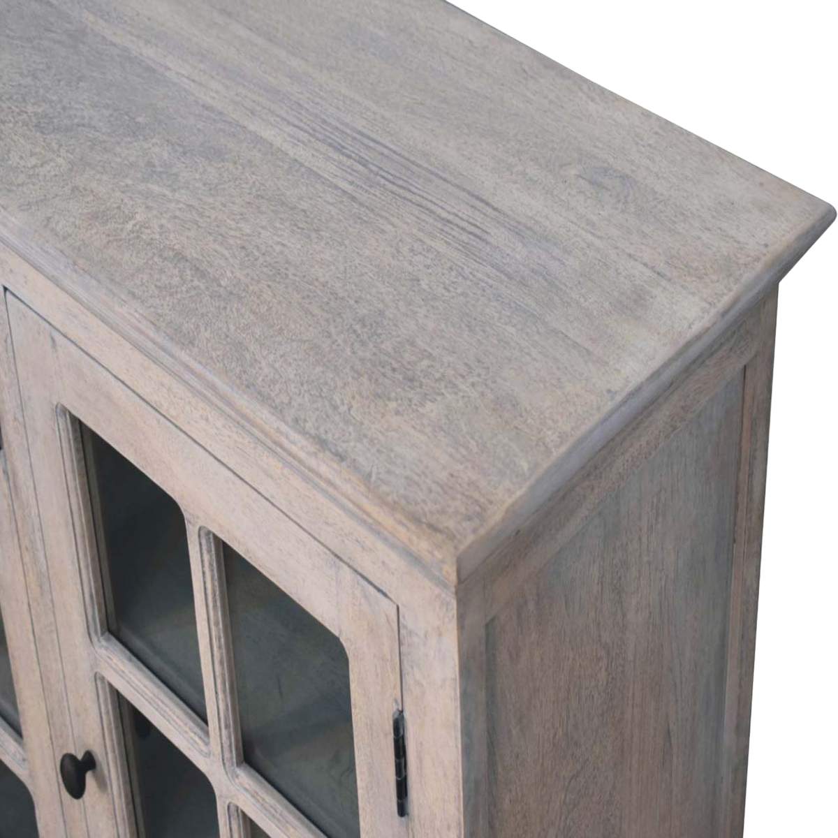 Close view of the glazed door and brass knob on the Sigtuna Glazed Sideboard in Stone.