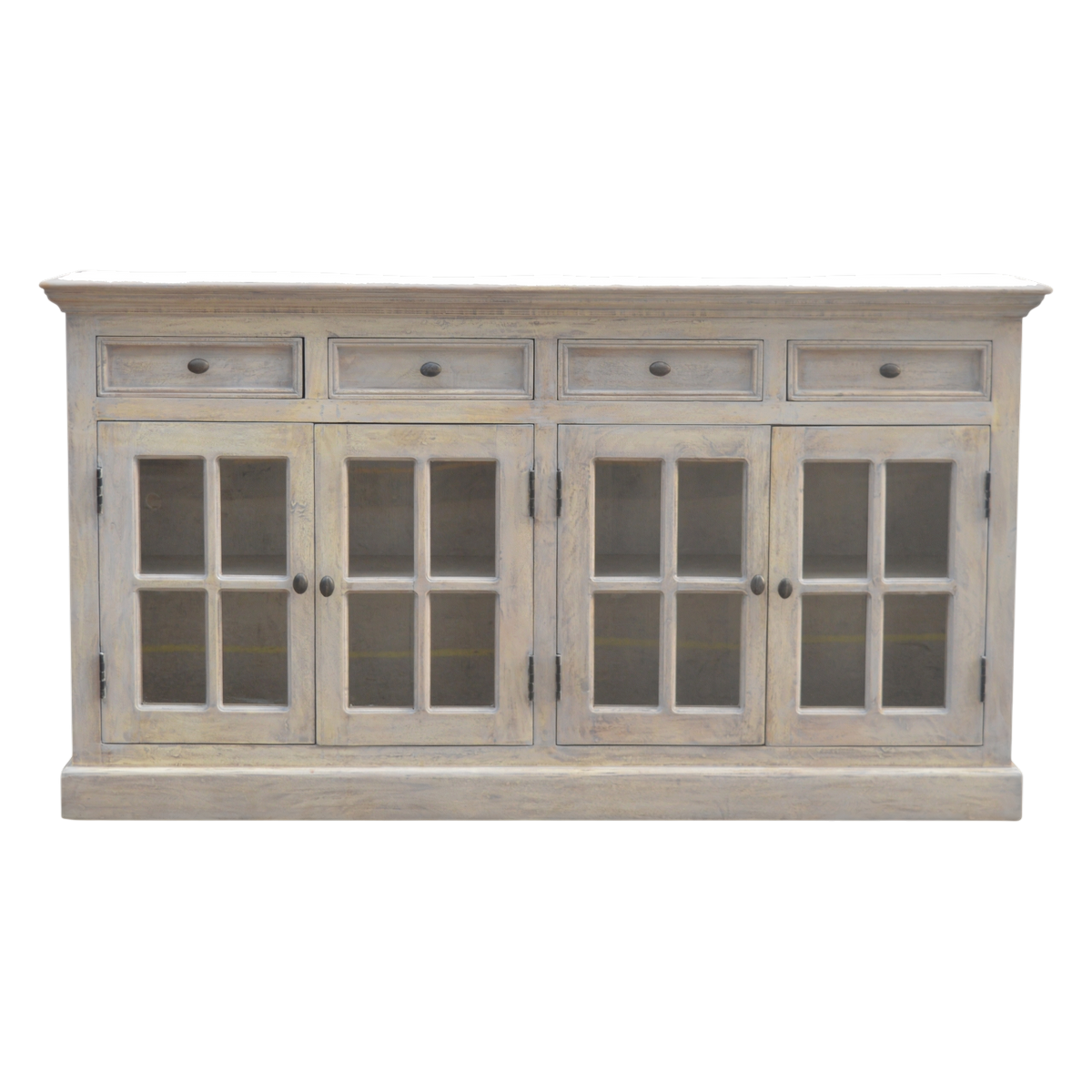 Sigtuna Glazed Sideboard with Drawers in Stone, front view. Solid hardwood throughout, caustic-washed to a pale weathered surface, four glazed doors shelved behind.