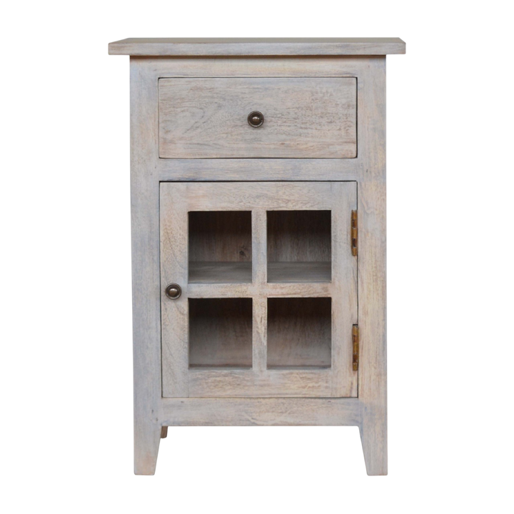 Sigtuna Mini Glazed Bedside Table in Stone, front view. Acid-washed hardwood with one drawer over a glazed cupboard.
