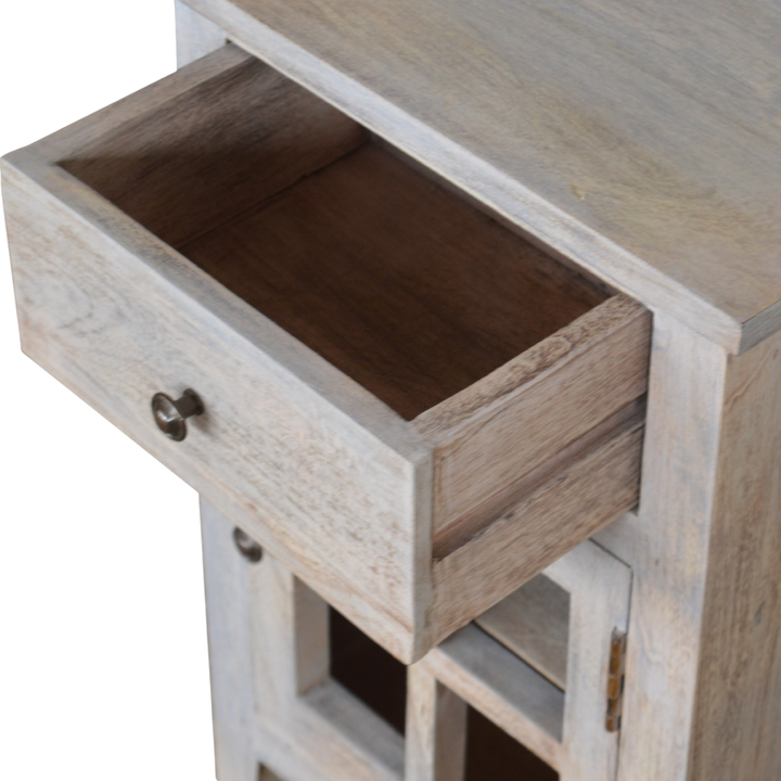 Sigtuna Mini Glazed Bedside Table in Stone, shown with a drawer open.