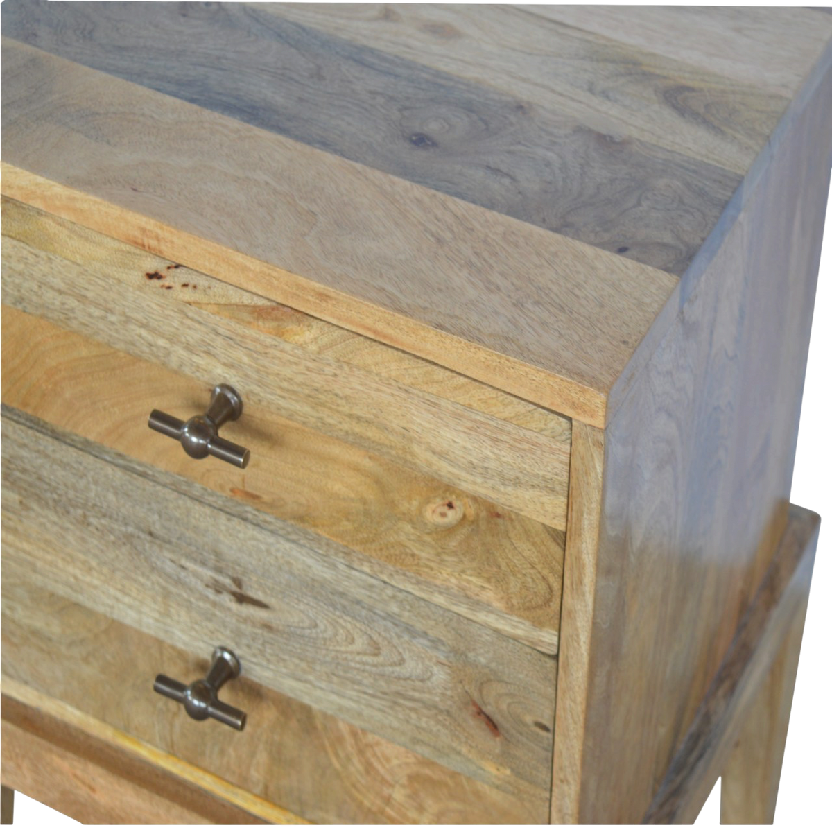 Close view of the brass hardware on the Skagen 2-Drawer Bedside Table in Amber.