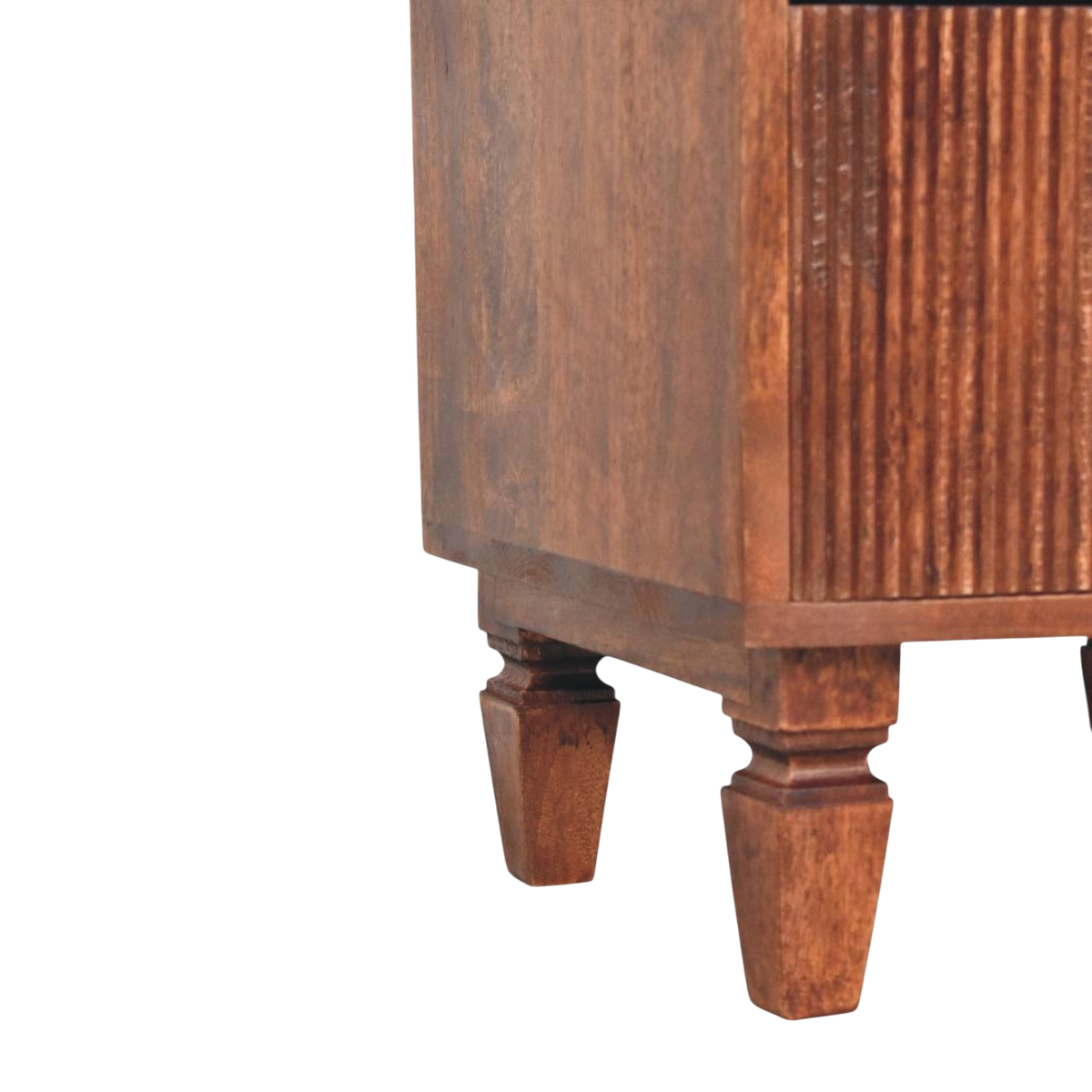 Close view of the turned legs on the Skagen Fluted Bedside Table in Amber.