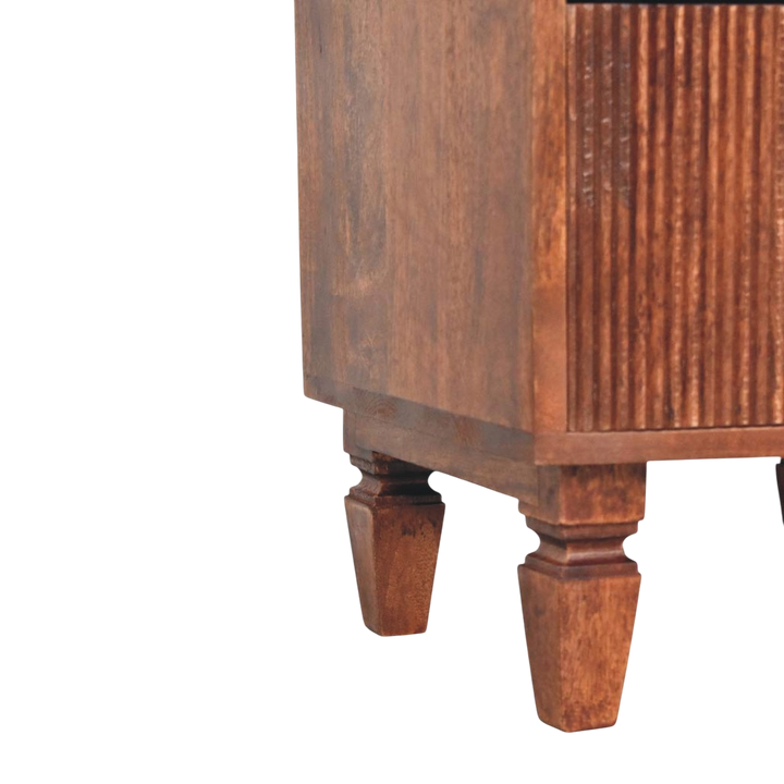 Close view of the turned legs on the Skagen Fluted Bedside Table in Amber.