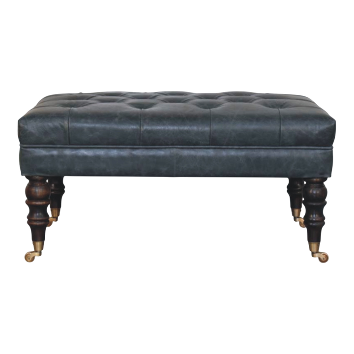 Sussex Leather Bench Ottoman in Slate, front view. Slate hide leather, deep-buttoned top, piped edge, turned 100% solid hardwood legs, brass castor wheels.