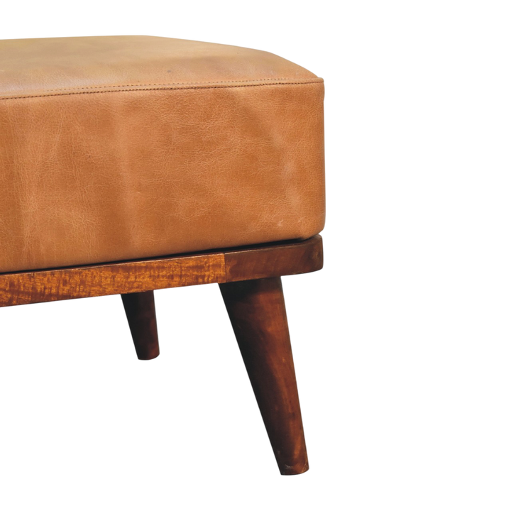Close view of the frame on the Sussex Leather Footstool in Blonde Saddle.