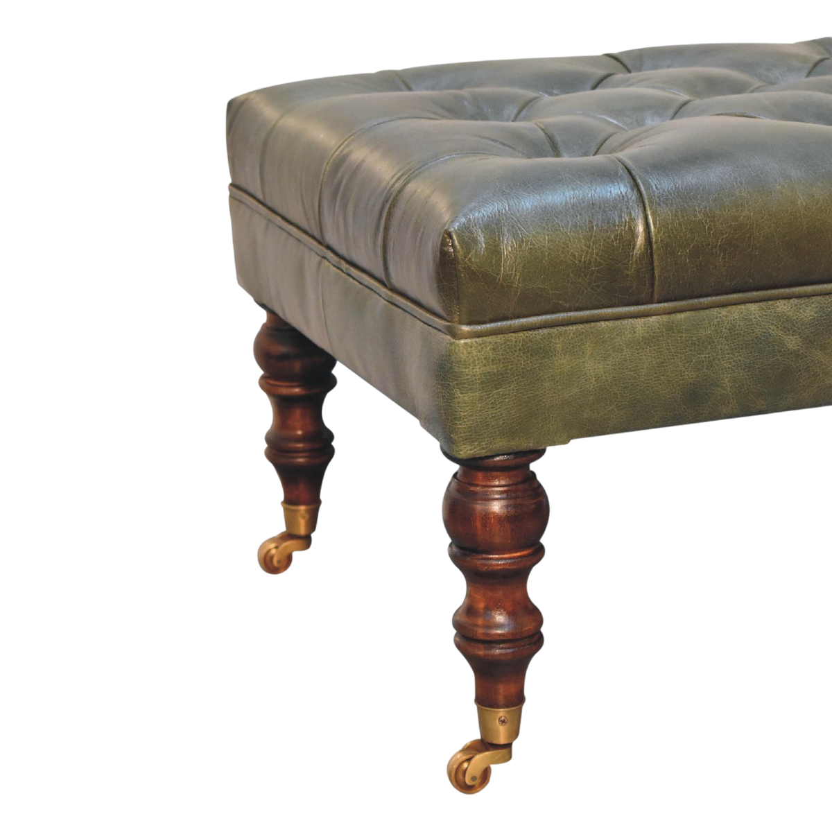 Close view of the turned legs and brass castors on the Sussex Leather Ottoman in Antique Green.