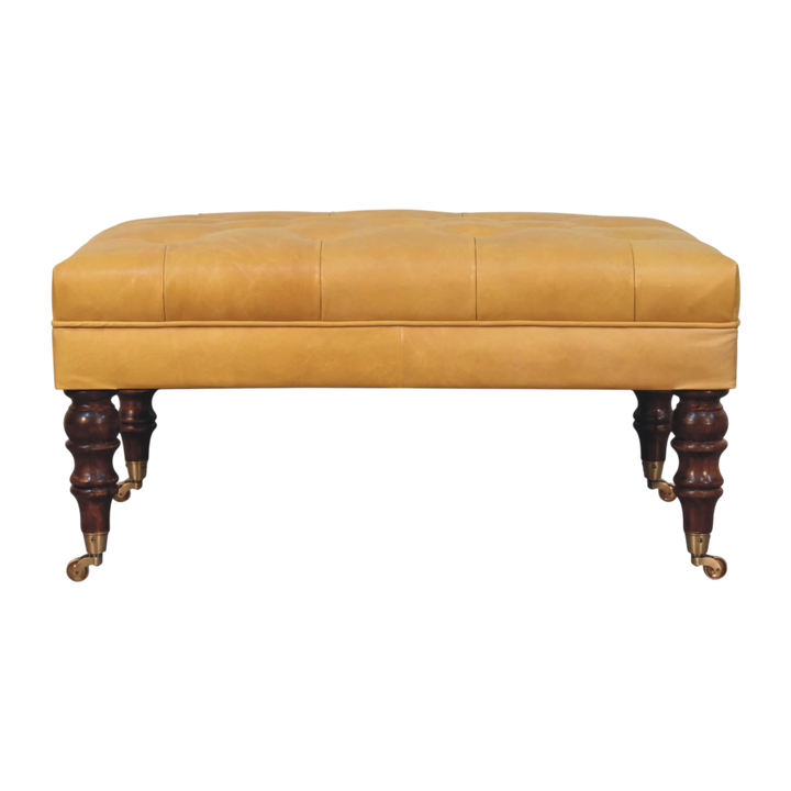 Sussex Leather Ottoman in Blonde Saddle, front view. Blonde saddle leather over a solid hardwood frame, deep-buttoned top.