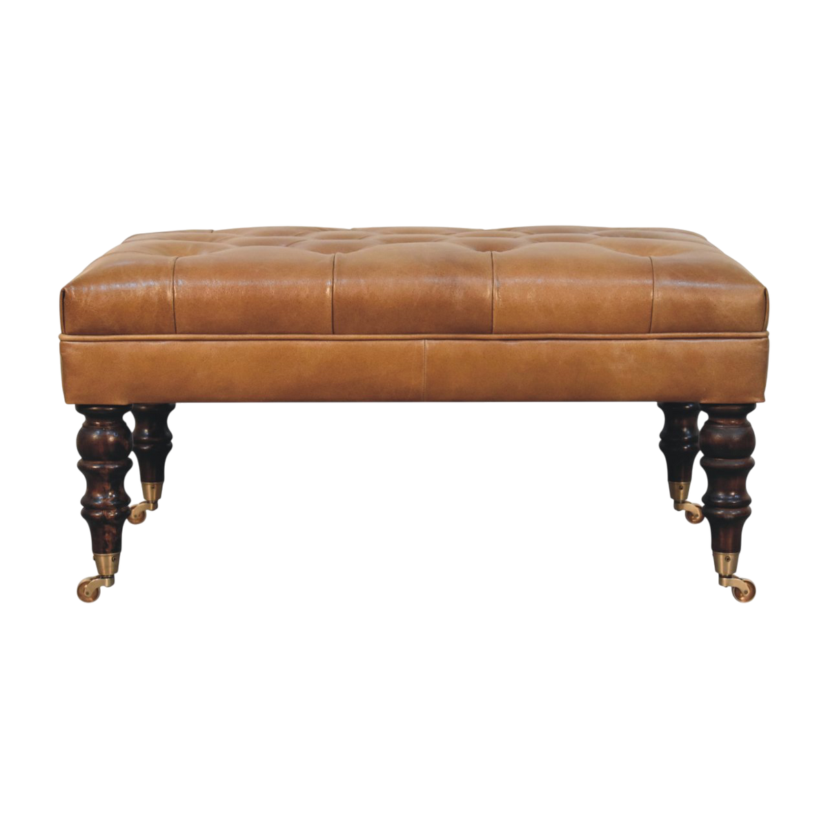 Sussex Leather Ottoman in Burnt Caramel, front view. Button-tufted caramel leather on turned chestnut legs with brass castors.