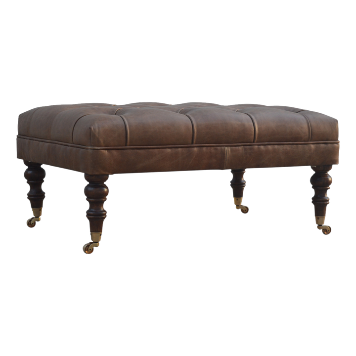 Sussex Leather Ottoman in Cocoa, three-quarter view showing the full profile.