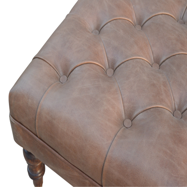 Close view of the hand-set buttoning on the Sussex Leather Ottoman in Cocoa.