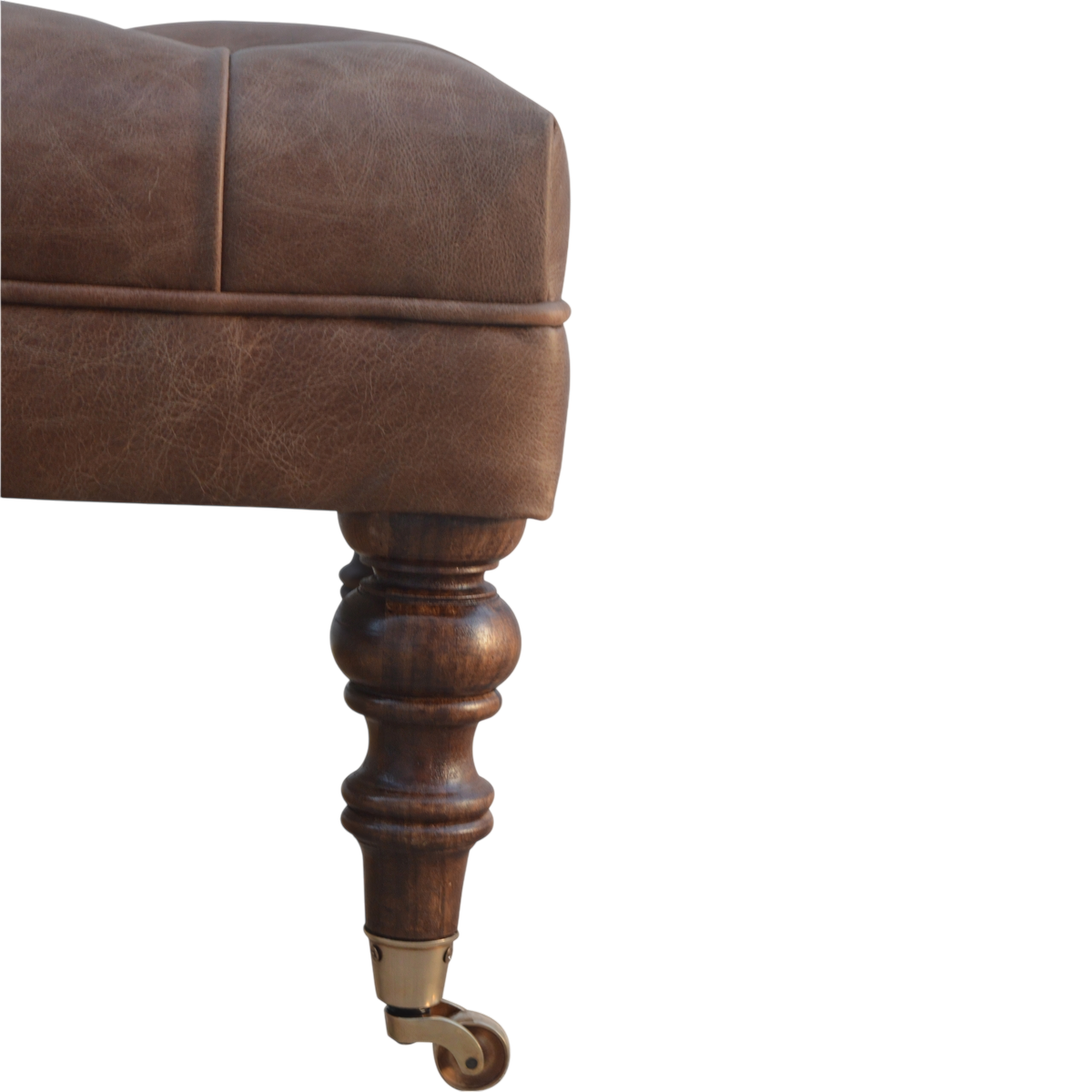 Close view of the brass castors on the Sussex Leather Ottoman in Cocoa.