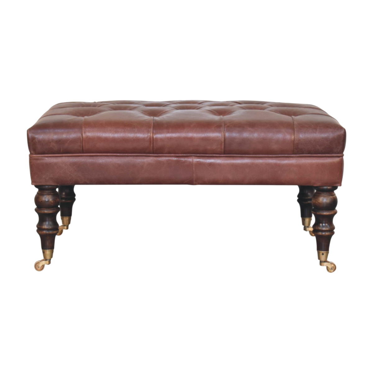 Sussex Leather Ottoman in Cognac, front view. Button-tufted cognac leather on turned wood legs with brass castors.