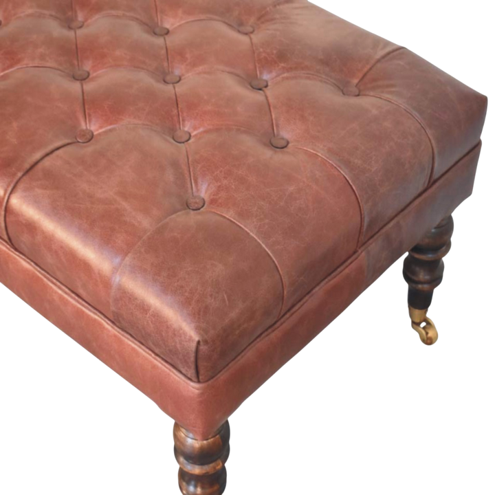 Close view of the button tufting and upholstery on the Sussex Leather Ottoman in Cognac.
