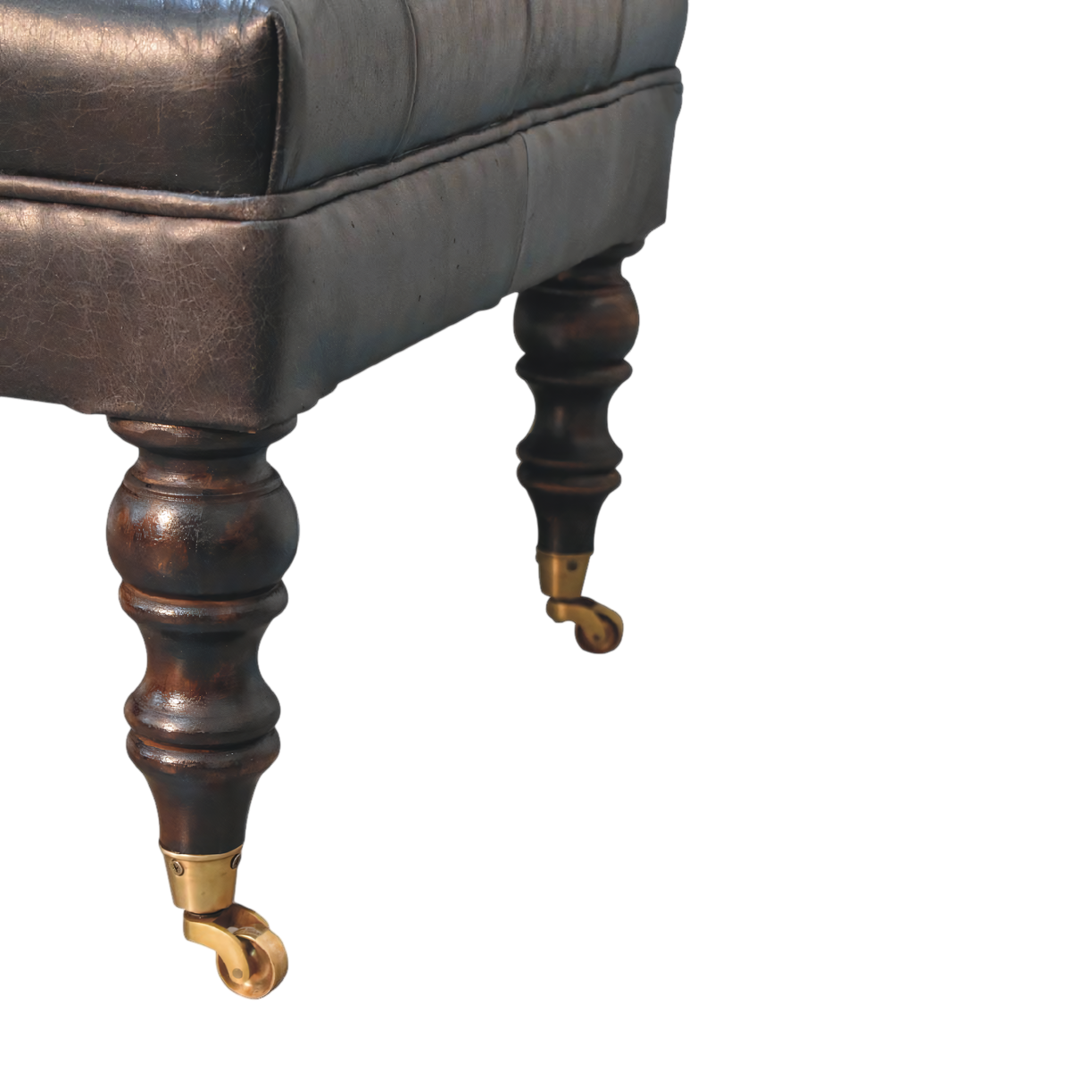 Close view of the brass castors on the Sussex Leather Ottoman in Espresso.
