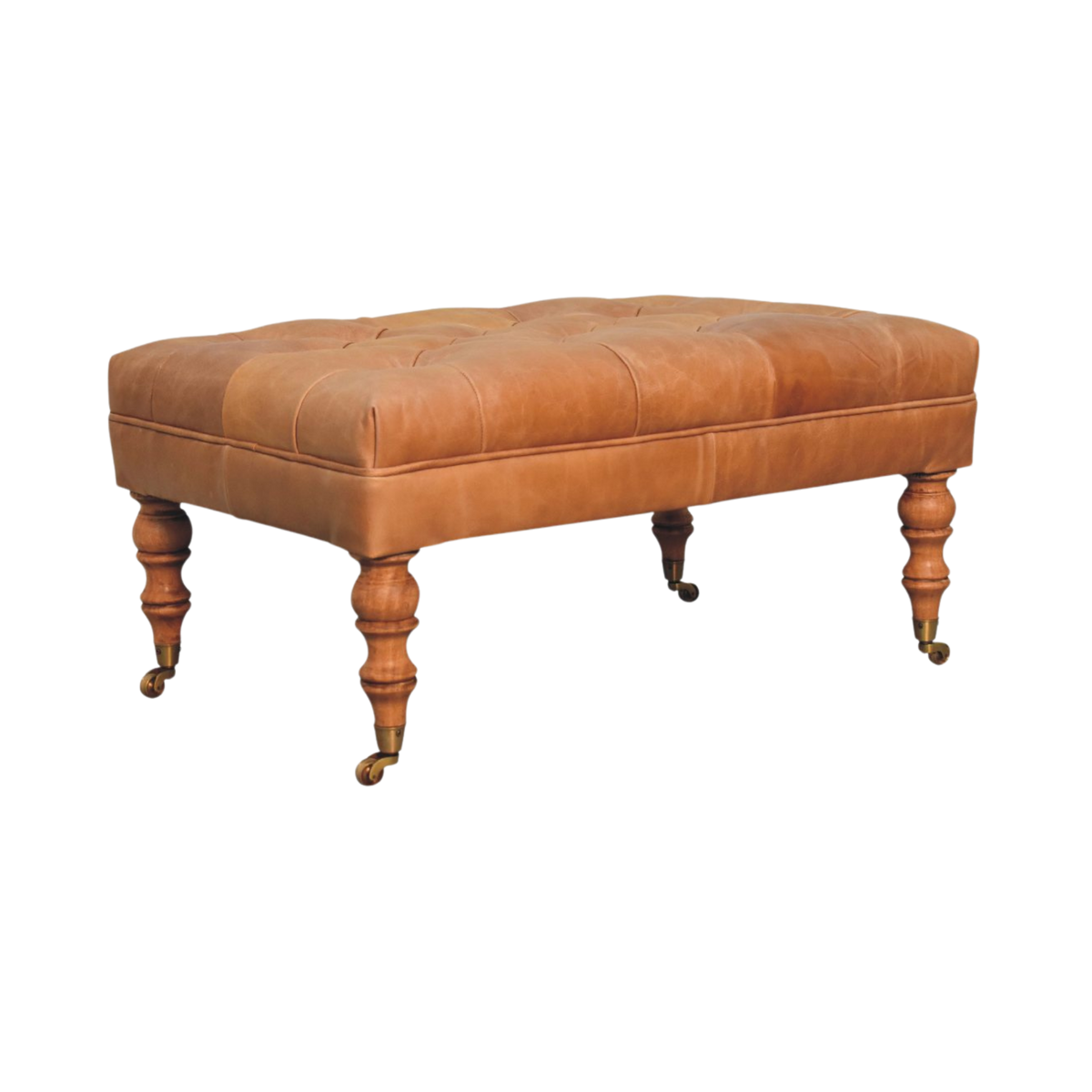 Sussex Leather Ottoman in Warm Biscuit, three-quarter view showing the depth of the seat and the leg profile.