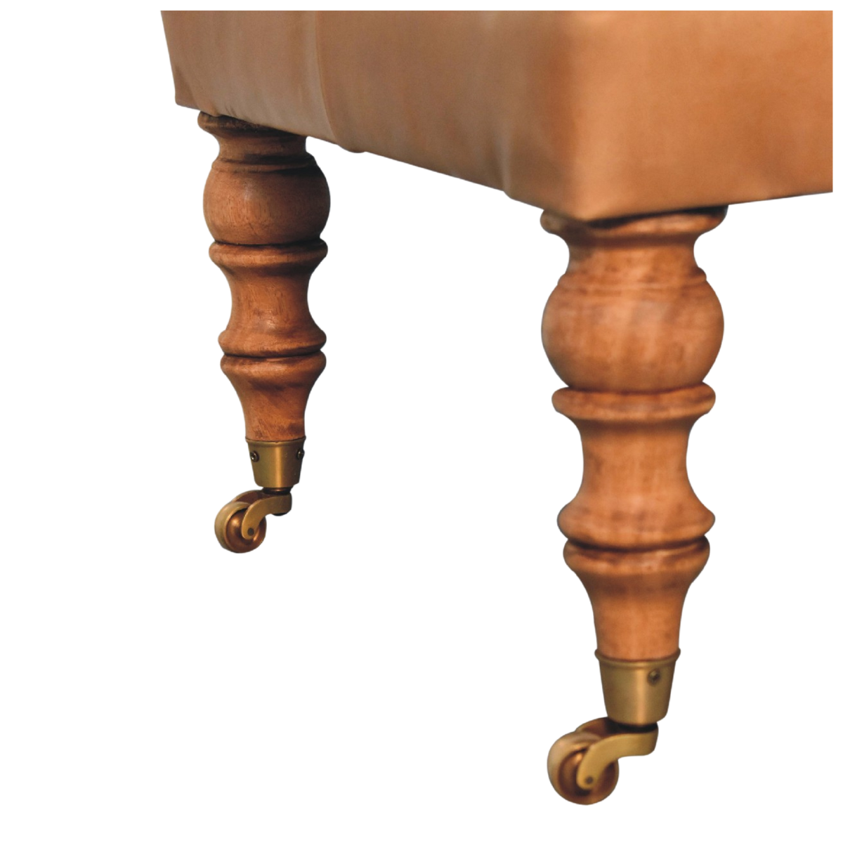 Close view of the turned chestnut legs and brass castors on the Sussex Leather Ottoman.