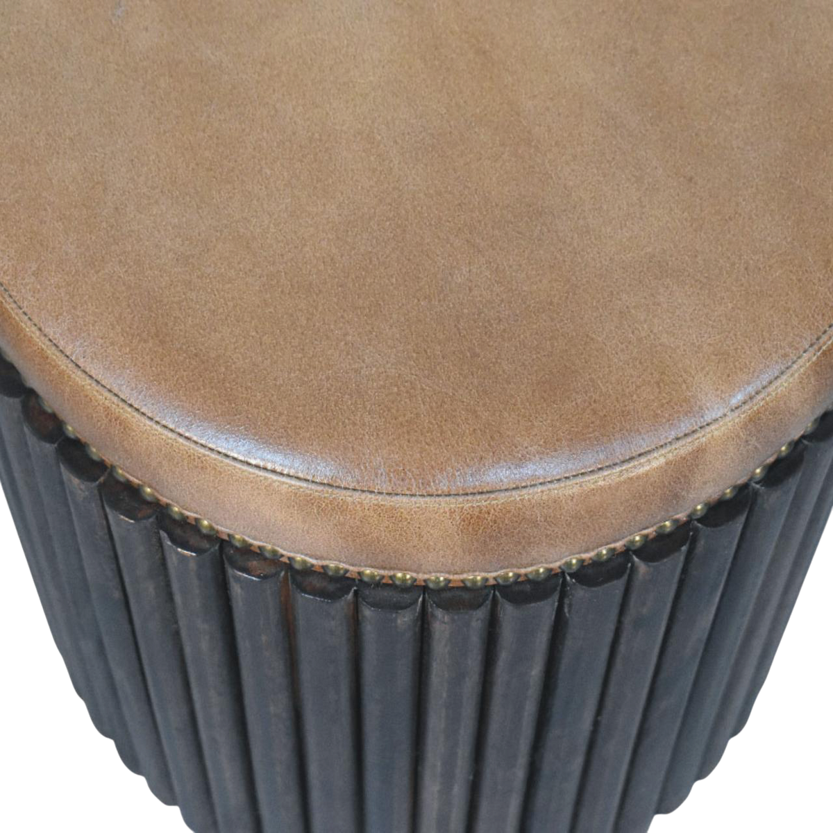 Close view of the stud trim on the Sussex Ribbed Leather Stool in Tobacco.