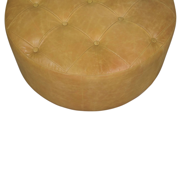 Close view of the hand-set buttoning on the Sussex Round Leather Coffee Table in Blonde Saddle.