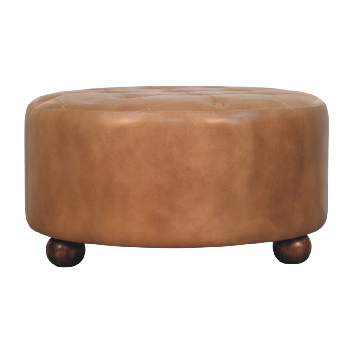 Sussex Round Leather Ottoman in Burnt Caramel, front view. Burnt caramel leather over a solid hardwood frame, hand-finished top with shallow tufting.