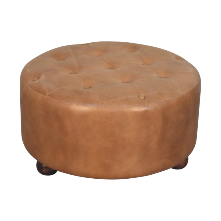 Sussex Round Leather Ottoman in Burnt Caramel, three-quarter view showing the full profile.