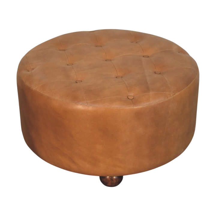 Close view of the hand-set buttoning on the Sussex Round Leather Ottoman in Burnt Caramel.