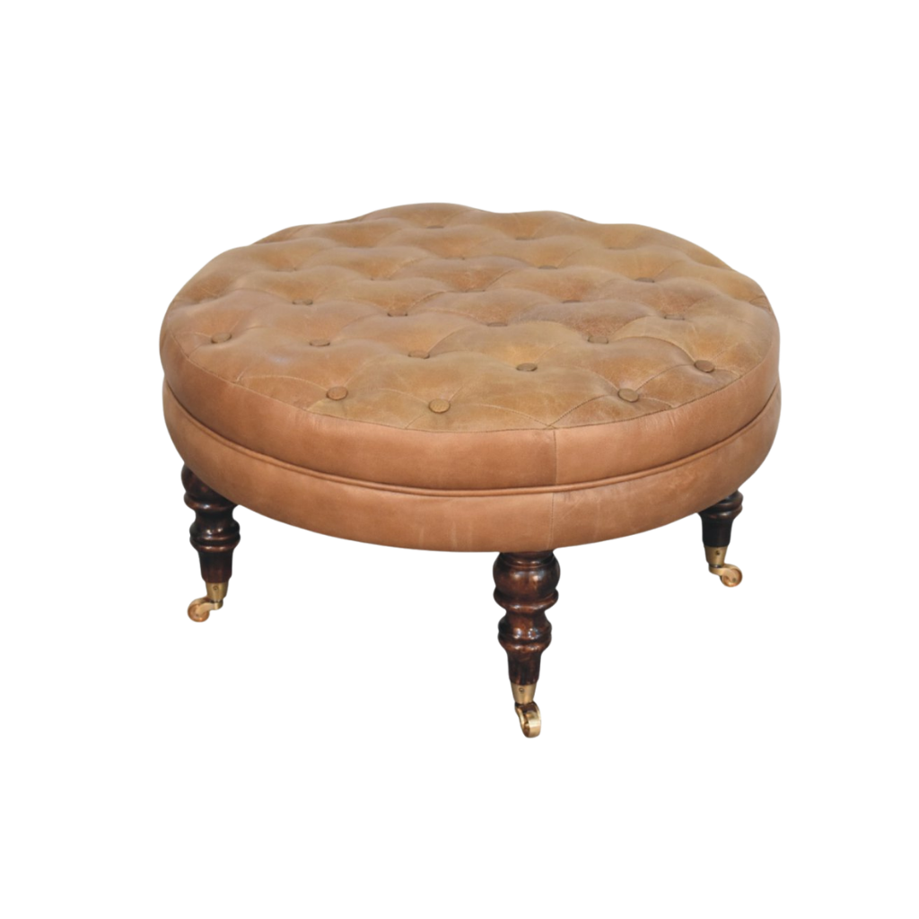 Sussex Round Leather Ottoman in English Toffee, front view. Round leather top on splayed chestnut legs.