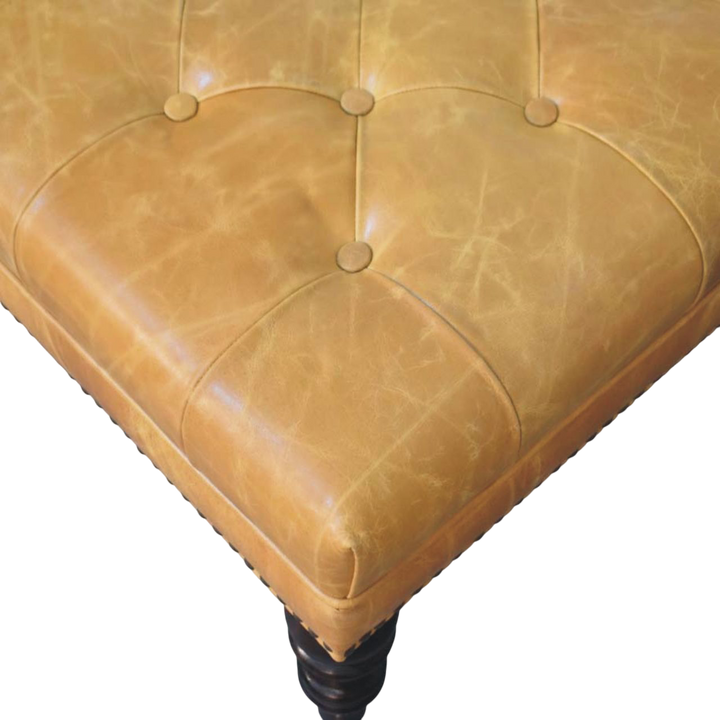 Close view of the stud detailing and button tufting on the Sussex Square Leather Ottoman with Nailheads in Blonde Saddle.